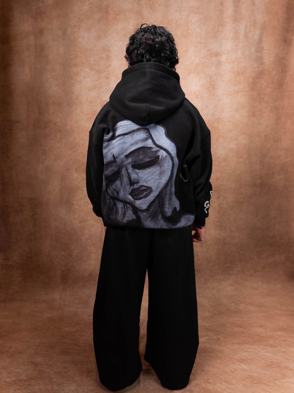 Black Hoodie with Monochrome Painted Face Back Graphic